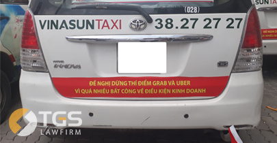 Ý kiến của Luật sư về việc một số hãng Taxi dán khẩu hiệu phản đối GRAB, UBER